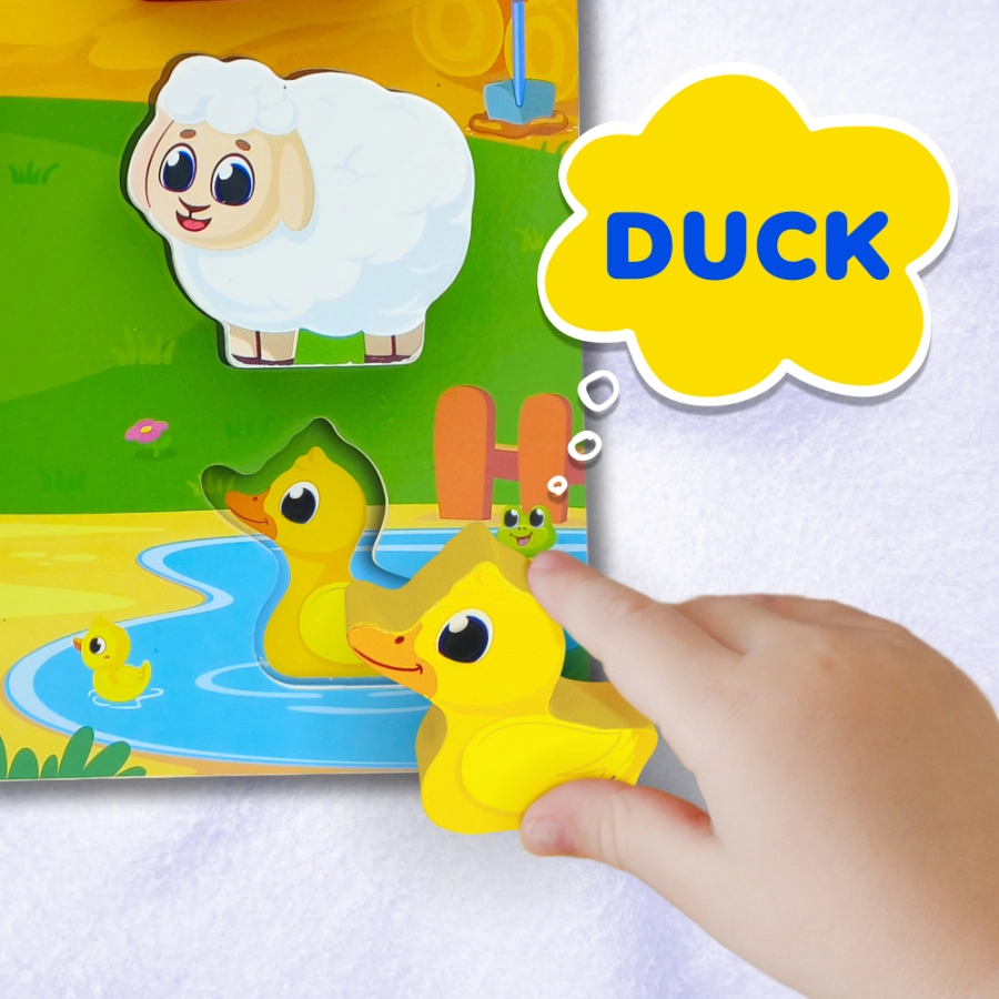 Cute farm animals puzzle piece being placed on a puzzle board